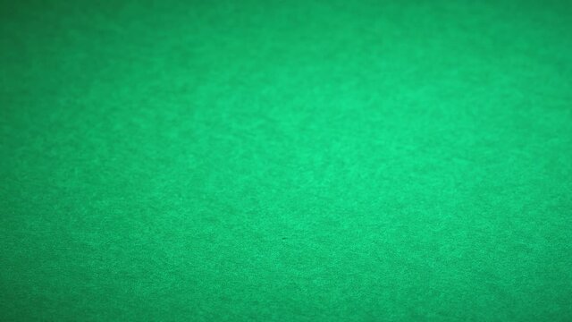 Stacks of poker chips on green casino table background