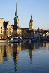 Old town of Zurich with churches Fraumünster (German), translation is Women's Minster, and St. Peter. Photo taken March 30th, 2021, Zurich, Switzerland.