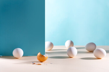 Easter background. White eggs with golden shell on a blue background