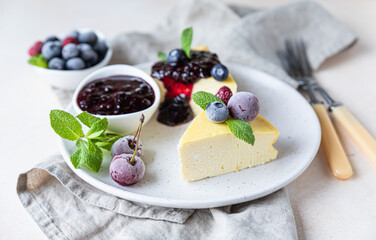 Sliced cottage cheese casserole or no crust cheesecake decorated with berries and mint. Ricotta casserole. Healthy breakfast or dessert.