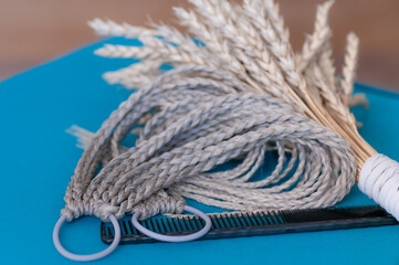 Hair accessory elastic band with braids in natural light color