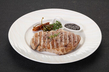 Grilled pork steak with pepper sauce