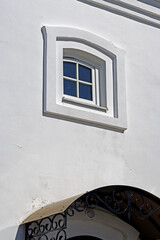 A fragment of the facade of an old building in the rays of the spring sun