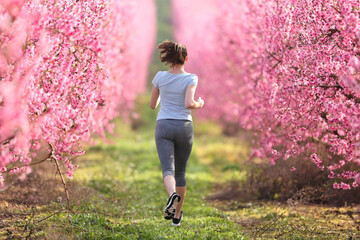 Full body of a jogger running in a field