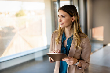 Business woman designer working on tablet in office