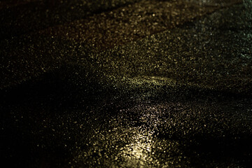 Car headlights on a wet road