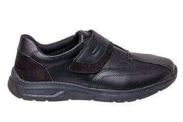 Mans black shoes. Close-up of a single black sneaker or sport shoe isolated on a white background. Elegant and trendy mens footwear. Clipping path. Macro.