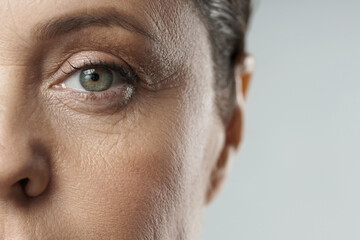 Close-up of female eye. Rejuvenation or Ophthalmology concepts. - obrazy, fototapety, plakaty