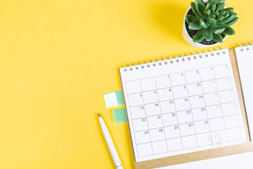 closing month calendar for 2021 on yellow background, planning a business meeting or travel...