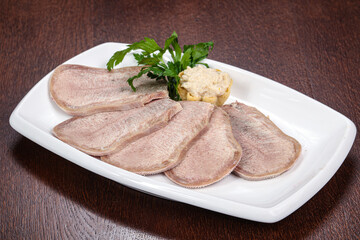 Sliced beef tongue on the plate
