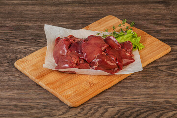 Raw chicken liver over board