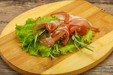 Sliced pork Jamon with rosemary