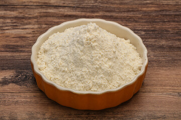 Wheat flour heap in the bowl