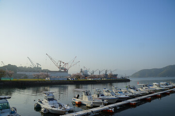 cherry blossoms, boats and factory.