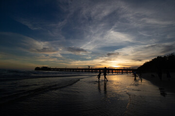 Silhouette of the pier at Mae Ramphueng Beach, Rayong, Thailand