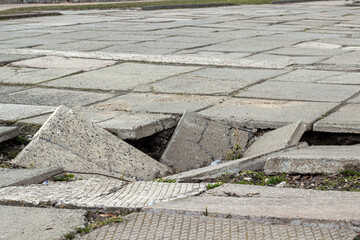 hole in a broken street on a pedestrian area