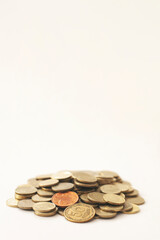 Mixed coin stacks on a white background