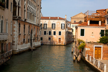 Fototapeta na wymiar Sinking city Venice beautiful view on narrow beautiful canal with ancient buildings in Italy