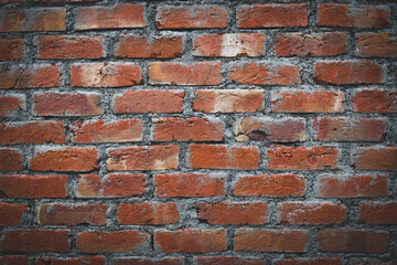 red bricks wall vintage background with vignette effect and copy space