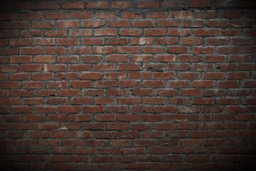 red bricks wall vintage background with vignette effect and copy space