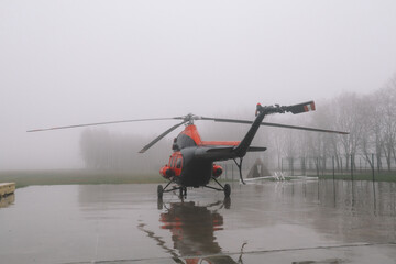 A small airfield with airplanes. Aircraft details. Old helicopters