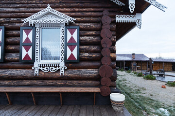 carved platbands on the windows. decorative decoration with wooden ornaments of window shutters....