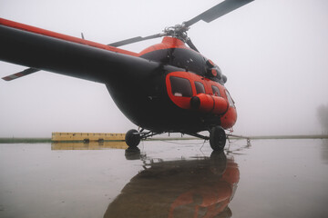 A small airfield with airplanes. Aircraft details. Old helicopters
