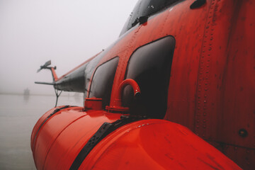 A small airfield with airplanes. Aircraft details. Old helicopters