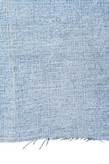 Piece of light blue jeans fabric