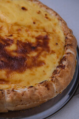 Parisian Flan, cutted classic tart served on a plate copy space. High quality photo