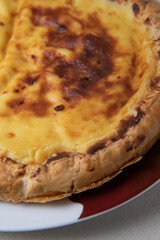 Parisian Flan, cutted classic tart served on a plate copy space. High quality photo