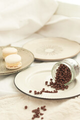 Chocolate granules for making melted chocolate. Confectionery chocolate. Chocolate round sweets.
