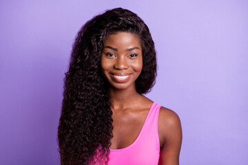 Photo of young attractive black woman happy positive toothy smile isolated over purple color...