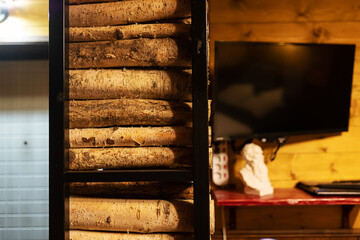 firewood in the woodpile. prepared fuel for kindling the stove in a country house. background texture of felled trees