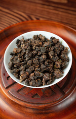 Chinese tea pellets in a white cup