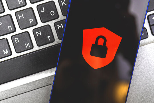 Concept of access denied, personal data protection and security, background of smartphone with red lock and laptop