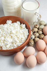 Natural farm products. Chicken and quail eggs, bottle and glass of cow's milk