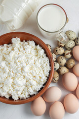 Natural farm products. Chicken and quail eggs, bottle and glass of cow's milk