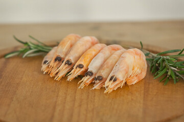 boiled shrimps are on the board, a snack for beer