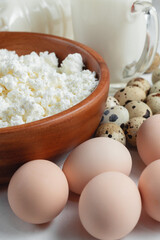 Natural farm products. Chicken and quail eggs, bottle and glass of cow's milk