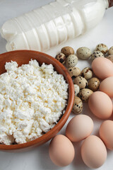 Natural farm products. Chicken and quail eggs, bottle and glass of cow's milk