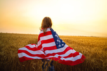 Adorable patriotic girl wearing an American flag in a beautiful