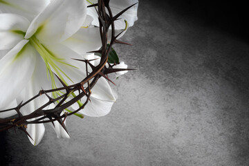 Good Friday, Passion of Jesus Christ. Crown of thorns, nails and white lily on grey background....
