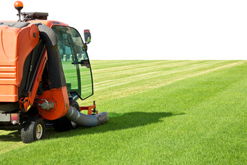Ride on lawn mower cutting fresh grass - Image with copy space