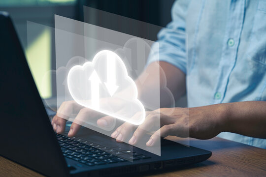 Virtual Cloud and technology icons , Businessman using laptop computer to control operations thru cloud computing system.