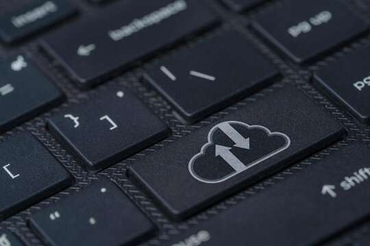 White cloud computing icon print screen on black laptop computer keyboard , Technology transformation and upload download concept.