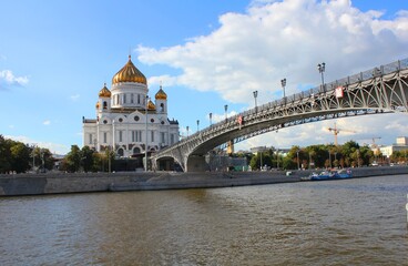 Cathedral of Christ the Savior in Moscow with a bridge over the Moscow river on a bright sunny day. 