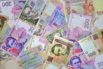 Modern Ukrainian money background - hryvnia. 500, 200, 100 banknotes. UAH. Business and finance concept