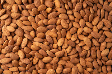 Almonds. Almond background. Almonds top view background. Whole nuts flat lay. Full depth of field.