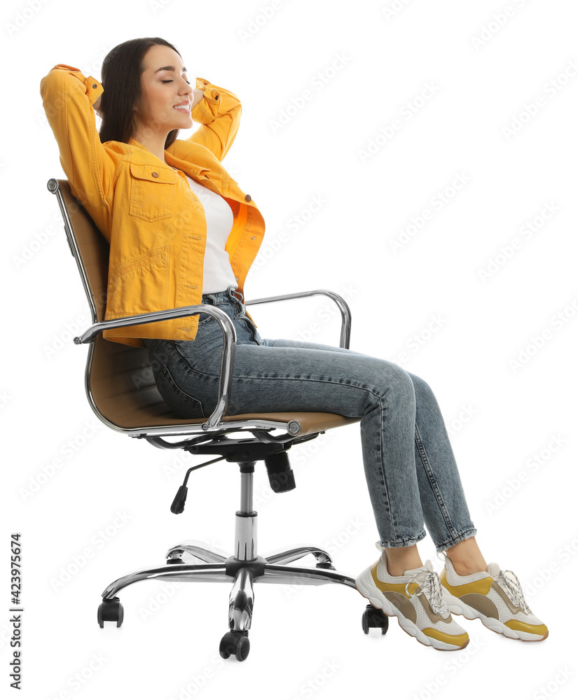 Wall mural Young woman relaxing in comfortable office chair on white background